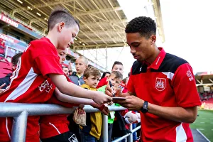 Bristol City's Zak Vyner Engages with Fans, Granting Autographs at Ashton Gate Stadium