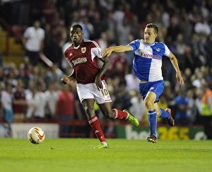 Images Dated 4th September 2013: Bristol Derby: Jay Emmanuel-Thomas vs Tom Lockyer Clash in Johnstone Paint Trophy First Round at