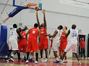 Bristol Flyers Alif Bland Blocks Determinedly Against Cheshire Phoenix in Basketball Action