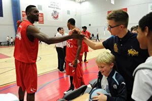 Images Dated 11th October 2014: Bristol Flyers Alif Bland Connects with Excited Fan Amidst BBL Cup Action