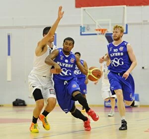 Images Dated 27th September 2014: Bristol Flyers Dwayne Lautier-Ogunleye Charges Forward in Basketball Action