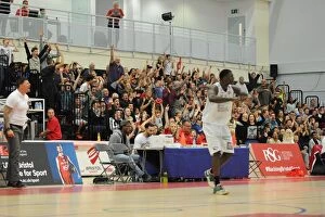 Fans Collection: Bristol Flyers Fans Go Wild as Team Scores in British Basketball Cup Match Against Plymouth Raiders