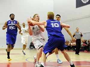 Images Dated 27th September 2014: Bristol Flyers Mathias Seilund Stops Plymouth Raiders Josh Wilcher in Basketball Action