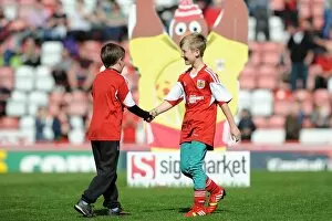 Images Dated 18th April 2014: Camaraderie on the Field: Young Rivals Leo Worlock and Luca Fortuna Celebrate Bristol City's Win