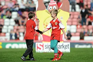 Camaraderie on the Field: Young Rivals Leo Worlock and Luca Fortuna Celebrate Bristol City's Win Against Notts County