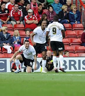 Images Dated 14th September 2013: Celebrating the Goal: Barnett, Assombalonga, and Tomlin of Peterborough United at Ashton Gate