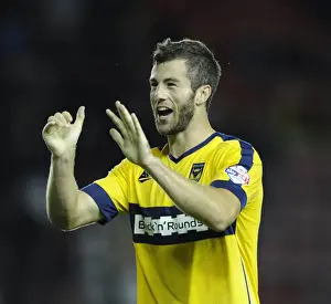 Celebrating the Upset: Oxford United's Jonathan Meades Rejoices after Defeating Bristol City in the Capital One Cup