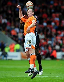 Images Dated 2nd May 2010: Challenge for the Skies: Adam vs. Elliott in Blackpool vs. Bristol City Football Rivalry