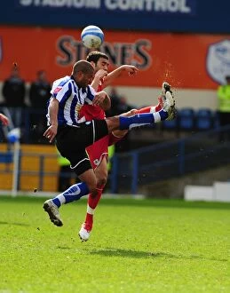 Images Dated 5th April 2010: Challenging Heights: Tudgay vs. Fontaine in the Championship Clash between Sheffield Wednesday
