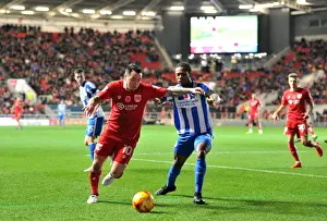 Bristol City V Brighton And Hove Albion Prints: Championship Clash: Lee Tomlin vs Gaetan Bong - A Battle at Ashton Gate
