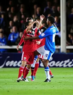 Images Dated 18th September 2012: Championship Clash: Temperatures Rise Between Peterborough and Bristol City Players