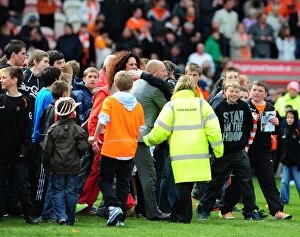 Blackpool v Bristol City Collection: Championship Glory: Emotional Blackpool Fans Invade Pitch as Ian Holloway Celebrates Title Win vs