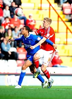 Images Dated 23rd October 2011: Championship Showdown: A Battle Between Jon Stead and Curtis Davies at Ashton Gate