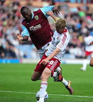 Burnley V Bristol City Prints: Championship Showdown: Burnley's Andre Bikey Fouls Jon Stead of Bristol City (September 25)