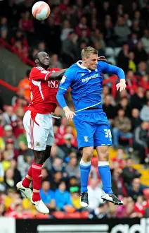 Bristol City V Birmingham City Prints: Championship Showdown: Damion Stewart vs Chris Wood - A High Ball Battle at Ashton Gate