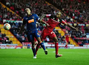 Bristol City V Blackpool Prints: Championship Showdown: Elliott vs John-Baptiste - A Battle for Possession