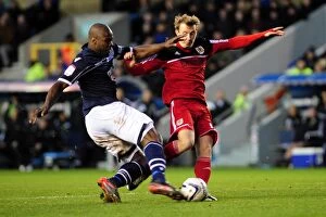 Images Dated 1st January 2013: Championship Showdown: Intense Moment as Millwall's Danny Shittu Challenges Bristol City's Martyn