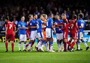 Images Dated 18th September 2012: Championship Showdown: Intense Moment as Players Clash Between Peterborough and Bristol City