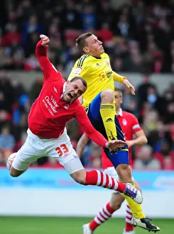 Nottingham Forest V Bristol City Prints: Chris Wood vs. Joel Lynch: Aerial Battle at The City Ground - Nottingham Forest vs