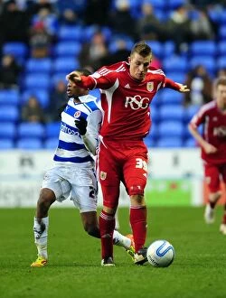 Images Dated 28th January 2012: Chris Wood vs Shaun Cummings: Battle for the Ball in Reading v Bristol City Championship Clash