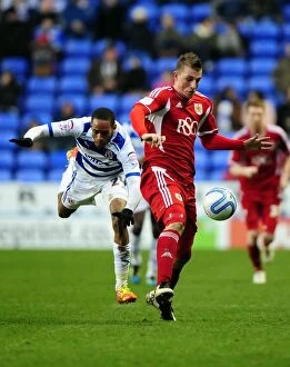 Images Dated 28th January 2012: Chris Wood vs Shaun Cummings: Intense Battle for the Ball in Reading vs Bristol City Championship