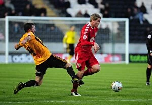 Images Dated 18th December 2010: Christian Ribeiro Fouled by Ian Ashbee: Hull City vs. Bristol City Championship Clash (18/12/2010)