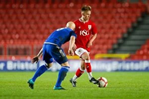 Images Dated 14th December 2015: Clash at Ashton Gate: Harvey Moss vs Lloyd Humphries - FA Youth Cup Third Round Showdown