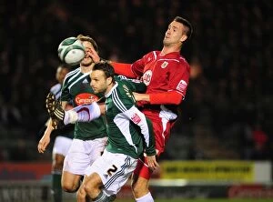 Images Dated 16th March 2010: Clash in the Championship: Stefan Maierhofer of Bristol City Battles Karl Duguid of Plymouth
