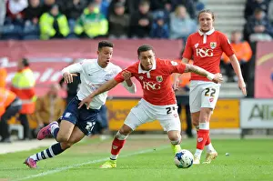 Title Race Prints: Clash at Deepdale: Preston's Robinson Stops Tavernier's Advance - Football
