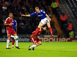 Images Dated 28th September 2010: Clash at Fratton Park: Skuse vs. Kitson - Championship Showdown between Bristol City's Cole Skuse