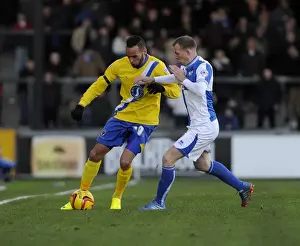 Clash at Memorial Stadium: David Clarkson of Bristol Rovers Tackles Kaid Mohamed of AFC Wimbledon