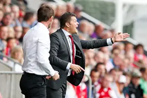 Clash on the Sidelines: Steve Cotterill vs Graham Alexander during Fleetwood Town vs Bristol City (2014)