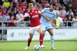 Images Dated 11th August 2013: Clash at Sixfields: Wagstaff vs. Thomas, Coventry vs. Bristol City, Sky Bet League One