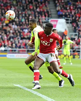 Bristol City V Huddersfield Town Prints: Clash of Stars: Agard vs van La Parra in Intense Championship Battle at Ashton Gate
