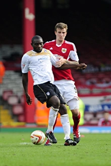 Bristol City V Colchester United Prints: Clash of the Titans: Aden Flint vs Jabo Ibehre