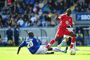 Images Dated 16th October 2010: Clash of Titans: Olofinjana vs. Adomah in Intense Npower Championship Battle at Cardiff City