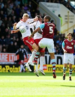 Burnley v Bristol City Collection: Clash at Turf Moor: Stead and Elliott Battle for Aerial Supremacy against Burnley's Carlisle