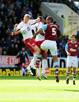 Burnley V Bristol City Prints: Clash at Turf Moor: Stead and Elliott Battle for Aerial Supremacy against Burnley's Carlisle