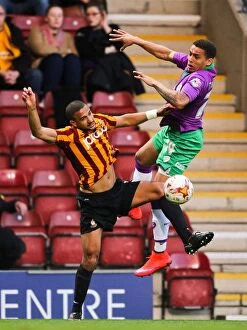 Images Dated 14th April 2015: Clash at Valley Parade: James Tavernier vs. James Meredith - The Battle for Promotion