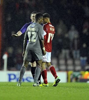 Images Dated 14th December 2013: Controversial Moment: Kieran Agard Dodges Bobby Reid Challenge in Bristol City vs Rotherham United