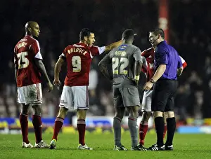 Bristol City V Rotherham United Prints: Controversial Moment: Kieran Agard Evades Bobby Reid's Challenge in Bristol City vs Rotherham United