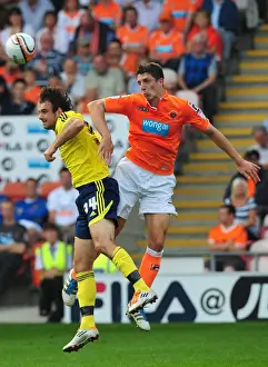 Blackpool V Bristol City Prints: Craig Cathart Outjumps Brett Pitman: Blackpool Secures Ball in League Cup Clash vs