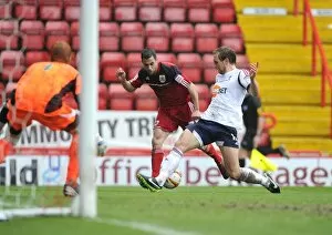Images Dated 13th April 2013: Craig Dawson Stops Sam Baldock's Cross: A Pivotal Moment in Bristol City vs Bolton Wanderers