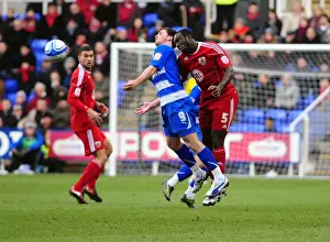 Damion Stewart Leaps Over Shane Long: A Championship Battle at Reading's Madejski Stadium (December 2010)