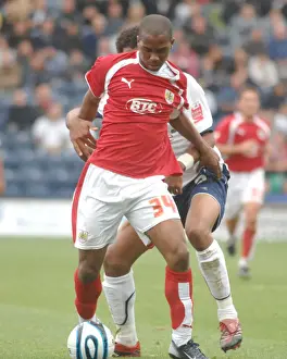 Darren Byfield tries to wrigggle past the preston defence