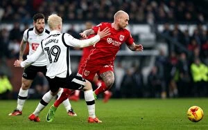 Images Dated 11th February 2017: David Cotterill Outmaneuvers Will Hughes: Intense Championship Showdown between Derby County