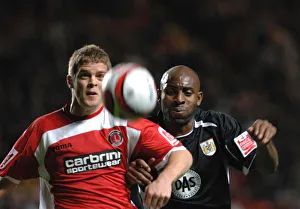 Dele Adebola chases Charltons Martin Cranie for the ball