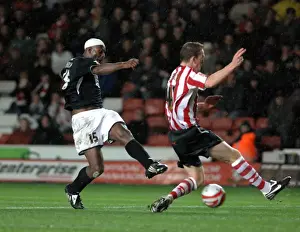 Dele Adebola sees his shot blocked by saints keeper kelvin davis