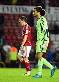 Bristol City v swindon town Collection: Disappointed David James and Neil Kilkenny Exit Ashton Gate After Bristol City's League Cup Loss