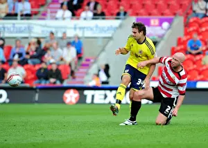 Framed Print : Doncaster's O'Connor Tackles Pitman in League Cup Clash between Doncaster Rovers and Bristol City - 27 / 08 / 2011